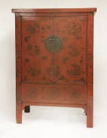 Lot 642 - A Chinese red lacquered wedding cabinet