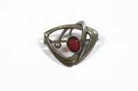 Lot 7 - A Charles Horner sterling silver single red paste stone brooch