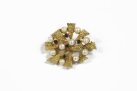Lot 27 - A textured 9ct gold cultured pearl and sapphire triangular spray brooch
7.32g