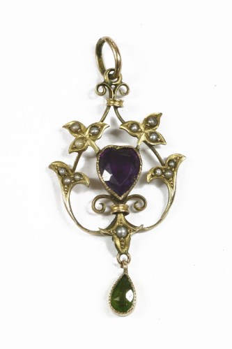 Lot 16 - An Edwardian gold purple and green paste possibly amethyst and seed pearl pendant with pear shaped peridot drop