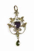 Lot 16 - An Edwardian gold purple and green paste possibly amethyst and seed pearl pendant with pear shaped peridot drop
