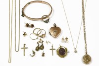 Lot 22 - A collection of gold items to include a cross marked 9ct