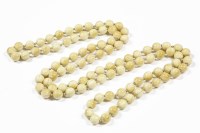 Lot 32 - A late 19th century single row uniformed circular ivory bead necklace