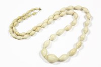 Lot 38 - A late 19th century single row graduated navette ivory bead necklace