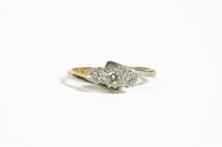 Lot 38D - A gold three stone diamond crossover ring