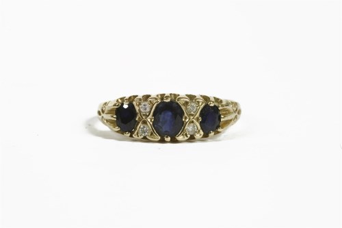 Lot 38 - A 9ct gold three stone sapphire ring
