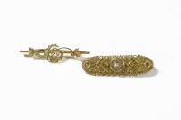 Lot 3 - A Victorian 9ct gold single stone diamond bar brooch