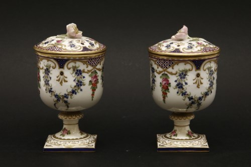 Lot 179 - A pair of early 20th century urns and covers