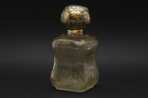 Lot 150 - A white metal topped perfume bottle