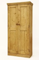 Lot 678 - A pine two door floor standing cupboard