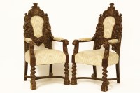 Lot 627 - A pair of Victorian carved oak throne chairs