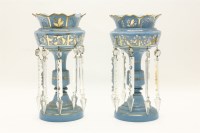 Lot 405 - A pair of blue glass and gilt lustres together with a similar ruby glass example