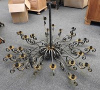 Lot 731 - A wrought iron twenty four light chandelier