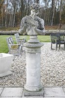 Lot 721 - A reconstituted stone bust of pan