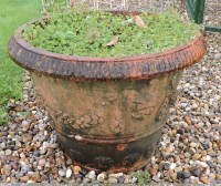 Lot 718 - A pair of terracotta urns