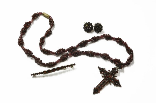 Lot 29 - A Victorian bohemian garnet set cross with modern garnet bead necklace