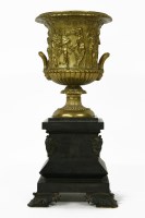 Lot 235 - A Victorian gilt metal urn of campana form