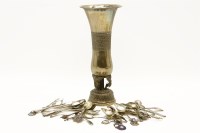 Lot 149 - An Indian white metal vase of trumpet form