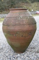 Lot 719 - A red earthenware garden pot