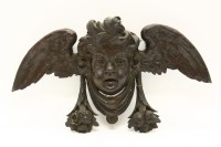 Lot 402 - A 17th century style oak wall hanging in the form of a cherub