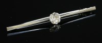 Lot 238 - A single stone diamond bar brooch