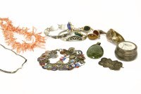 Lot 322 - A collection of costume jewellery to include a silver charm bracelet with assorted silver Continental town charms