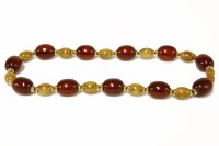 Lot 267 - A two colour graduated olive shaped cherry and butterscotch Bakelite necklace