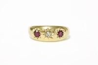 Lot 225 - An 18ct gold three stone star set diamond and ruby gypsy ring
3.63g size M