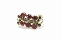 Lot 211 - A gold three row wave head ruby and diamond band ring