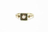 Lot 245 - An Art deco single stone pearl ring with a square frame