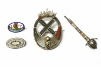 Lot 241 - Four assorted brooches to include a Victorian silver Scottish hardstone brooch
