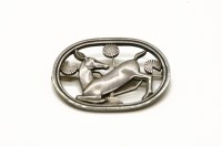 Lot 271 - A sterling silver kneeling deer brooch