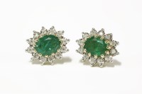 Lot 294 - A pair of 9ct gold oval emerald and illusion set diamond cluster earrings
3.30g