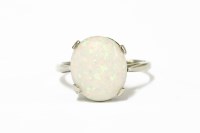 Lot 256 - A white gold single stone opal ring cabochon ring