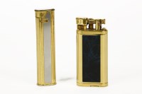 Lot 314 - Two Dunhill lighters: one gold plated and black