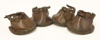 Lot 299 - A set of four leather and wooden pony's 'lawn shoes'