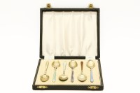 Lot 328 - A set of six silver gilt and coloured enamel coffee spoons