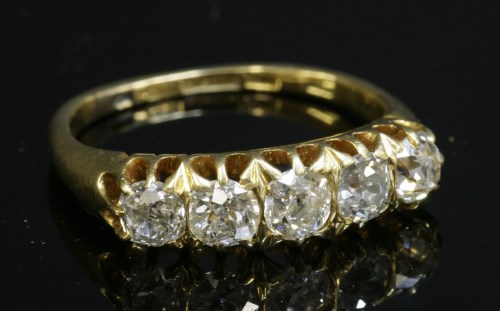 Lot 69 - An Edwardian gold graduated five stone diamond ring