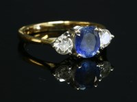 Lot 366 - An 18ct gold sapphire and diamond three stone ring