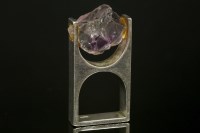 Lot 697 - A silver modernist amethyst ring
