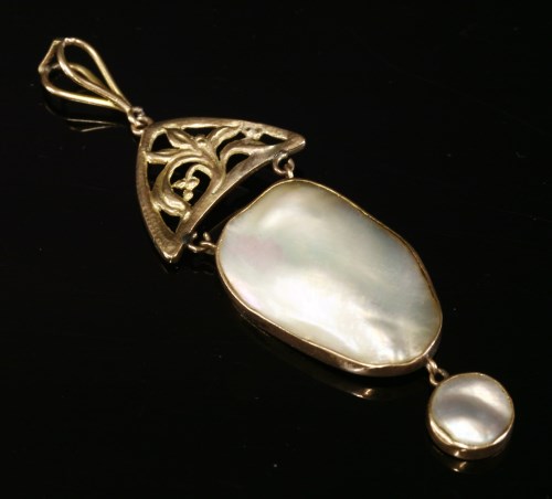 Lot 144 - A gold Arts and Crafts blister pearl pendant