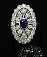Lot 173 - An Art Deco sapphire and diamond oval plaque ring