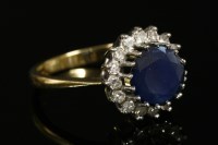 Lot 747 - An 18ct gold sapphire and diamond circular cluster ring