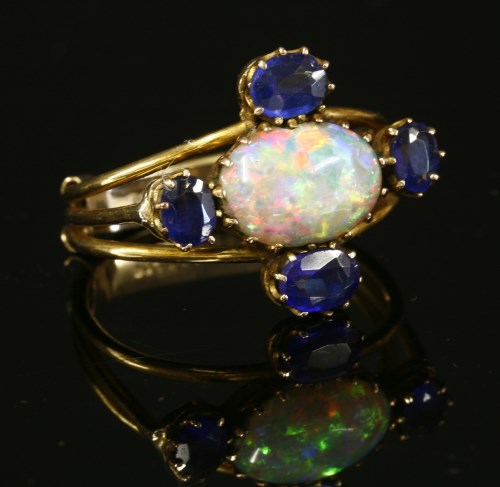Lot 66 - An Edwardian opal and doublet cinquefoil cluster ring