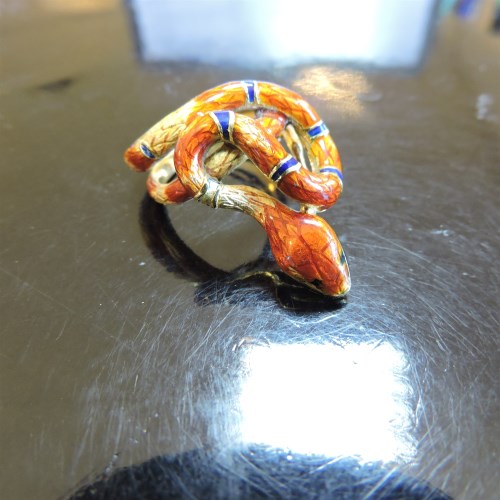Lot 311 - A gold and enamel serpent or snake ring
