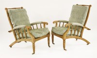 Lot 1 - A pair of oak reclining armchairs