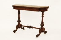 Lot 543 - A Victorian figured walnut card table