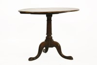 Lot 675 - An oak tripod table