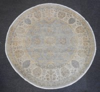 Lot 505A - A circular Persian rug