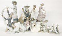 Lot 340 - A large collection of Nao and Lladro figurines